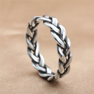 Close-up of vintage titanium steel braided chain ring with oxidized silver finish