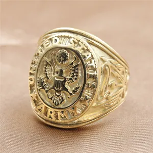 Macro view of gold-plated US Army eagle emblem engraved on men's vintage ring
