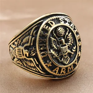 Macro shot of gold vintage US Army eagle ring featuring detailed wings and engraving