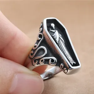 Gothic coffin ring in stainless steel with skull motif and ornate scrollwork details