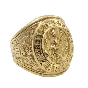 Macro shot of gold United States Army ring with detailed eagle emblem and side engraving