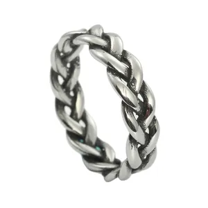 Detail view of vintage braided cable ring showing antique finish and punk textures