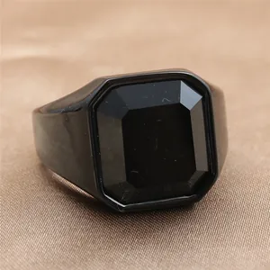 Macro shot of vintage black stainless steel ring with emerald-cut black gemstone