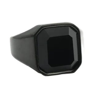 Detailed view of men's vintage black stainless steel signet ring with emerald-cut onyx stone