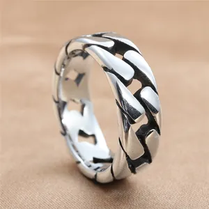 Close-up of vintage stainless steel Cuban link ring with flat chain punk design