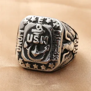 Macro detail of vintage USN anchor ring with embossed eagle and stars in stainless steel