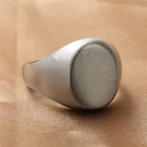 Minimalist vintage oval titanium steel ring with a brushed matte finish on gold silk