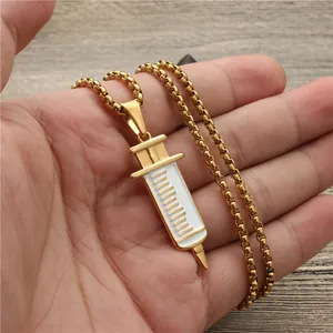 Golden syringe pendant necklace with scale details on a box chain for medical gift