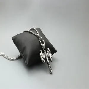 Vintage double-sided axe pendant necklace in surgical steel on a black satin display