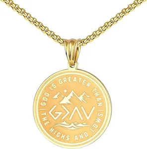 Detail of gold faith pendant engraved with God Is Greater Than The Highs And Lows quote