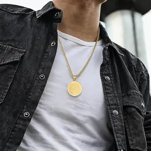 Men's gold stainless steel faith symbol coin pendant necklace worn with casual denim jacket