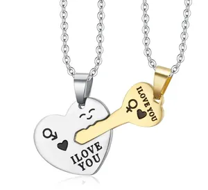 Detail of interlocking silver heart and gold key necklace set with I LOVE YOU engraving