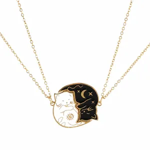 Cartoon Yin Yang cat necklace in gold with sun and moon patterns for couples