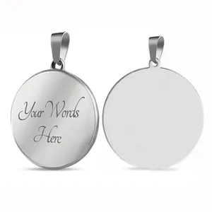 Polished stainless steel round pendant detail showing custom engraving on mirror finish