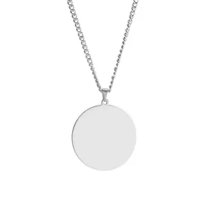 Macro view of mirror-finish stainless steel round pendant with smooth polished surface