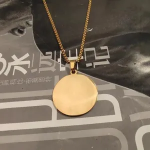 Polished golden stainless steel round disc pendant necklace on rectangular link chain