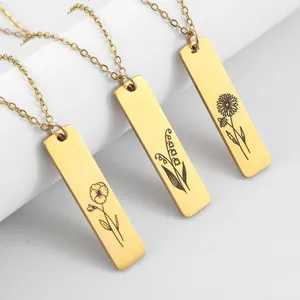 Three gold-plated stainless steel necklaces with rectangular flower engraved pendants