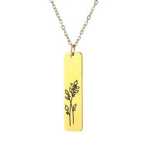 Detailed macro view of gold-plated rectangular flower pendant with matte brushed finish