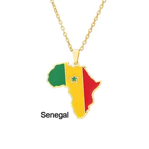 Close-up of golden Senegal map pendant with national flag colors and green star detail