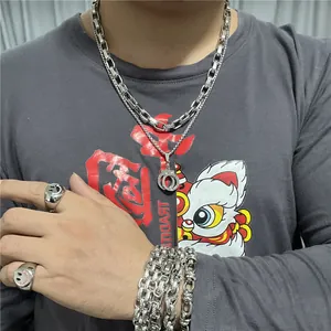 Punk style stainless steel handcuff necklace and smile ring set worn by model