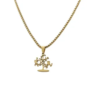 Macro detail of golden tree of life pendant with birds and box chain on white background