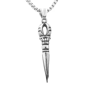 Close-up of a silver stainless steel Vajra pestle pendant with intricate punk carvings
