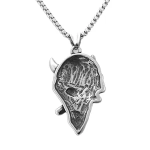 Macro detail of gothic bull skull pendant with vintage silver finish and steel chain