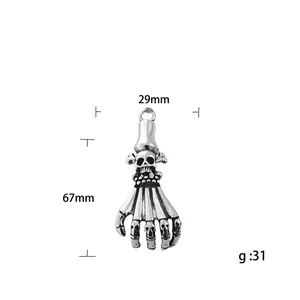 Vintage stainless steel skeleton hand claw pendant with skull details, 67mm height