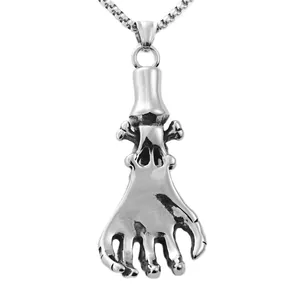 Close-up of gothic stainless steel skeleton hand claw pendant with a box chain necklace
