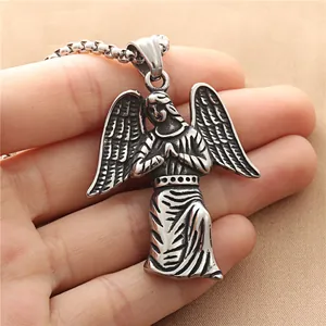 Vintage stainless steel angel wings pendant necklace shown on hand for size reference