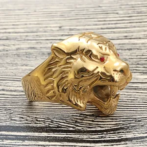 Gold titanium steel tiger ring with red stone eyes and detailed vintage engraving