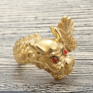 Retro punk titanium steel dragon head ring in gold finish with red gemstone eyes