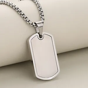Macro detail of silver rectangular military dog tag pendant with a sturdy steel box chain