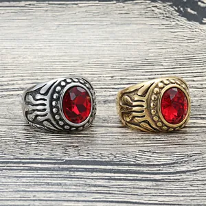 Macro view of vintage titanium steel rings featuring large oval red gemstones