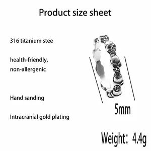 Detailed view of a 5mm 316 stainless steel ring featuring repeating 3D skull patterns