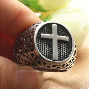 Vintage stainless steel cross signet ring for men featuring an embossed relief shield