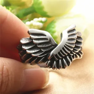 Vintage eagle wing ring in silver stainless steel with punk style retro finish on hand