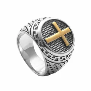 Vintage punk men's stainless steel signet ring with golden cross on black grid background