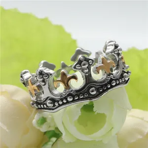 Retro punk crown ring in silver steel with golden fleur-de-lis and beaded edges