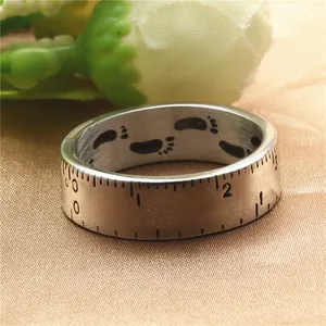 Vintage titanium steel ruler ring with engraved scale and footprint on gold silk