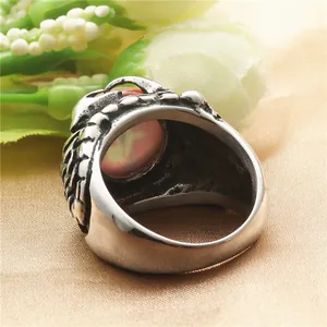 Vintage stainless steel dragon claw ring featuring a pink opal stone in punk style