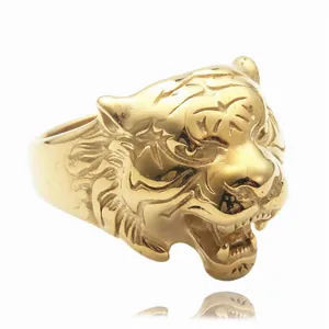 Macro view of a realistic tiger head ring in polished gold-plated stainless steel
