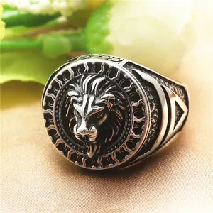 Detailed close-up of a vintage lion head punk ring in brushed stainless steel finish
