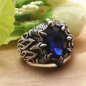 Retro punk dragon claw stainless steel ring with a large blue oval stone for men