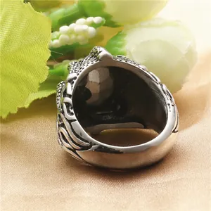 Retro punk dragon claw ring in vintage titanium steel with a detailed gothic metal texture