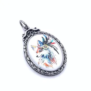 Detailed close-up of retro titanium steel oval pendant with colorful fox art engraving