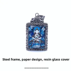 Macro view of vintage steel zodiac pendant with resin glass shell and paper Buddha pattern
