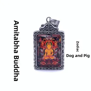 Macro shot of silver titanium steel thangka pendant featuring Amitabha Buddha for dog and pig