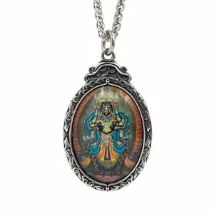 Vintage titanium steel Thangka pendant featuring colorful Tibetan deity and floral relief