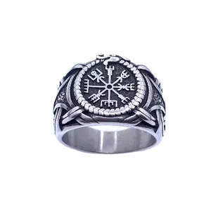 Vintage stainless steel Viking compass ring featuring detailed Ouroboros relief carvings